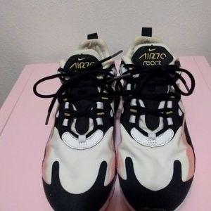 Womens Nike Shoes kind of of peachy pink black and white